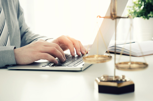 Woman typing on a keyboard